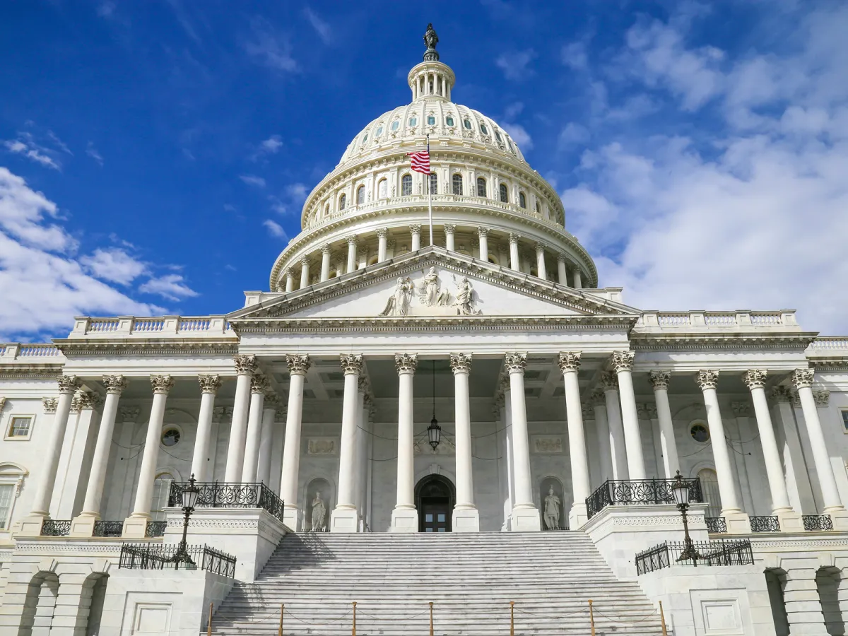 The United States Capitol under a blue sky